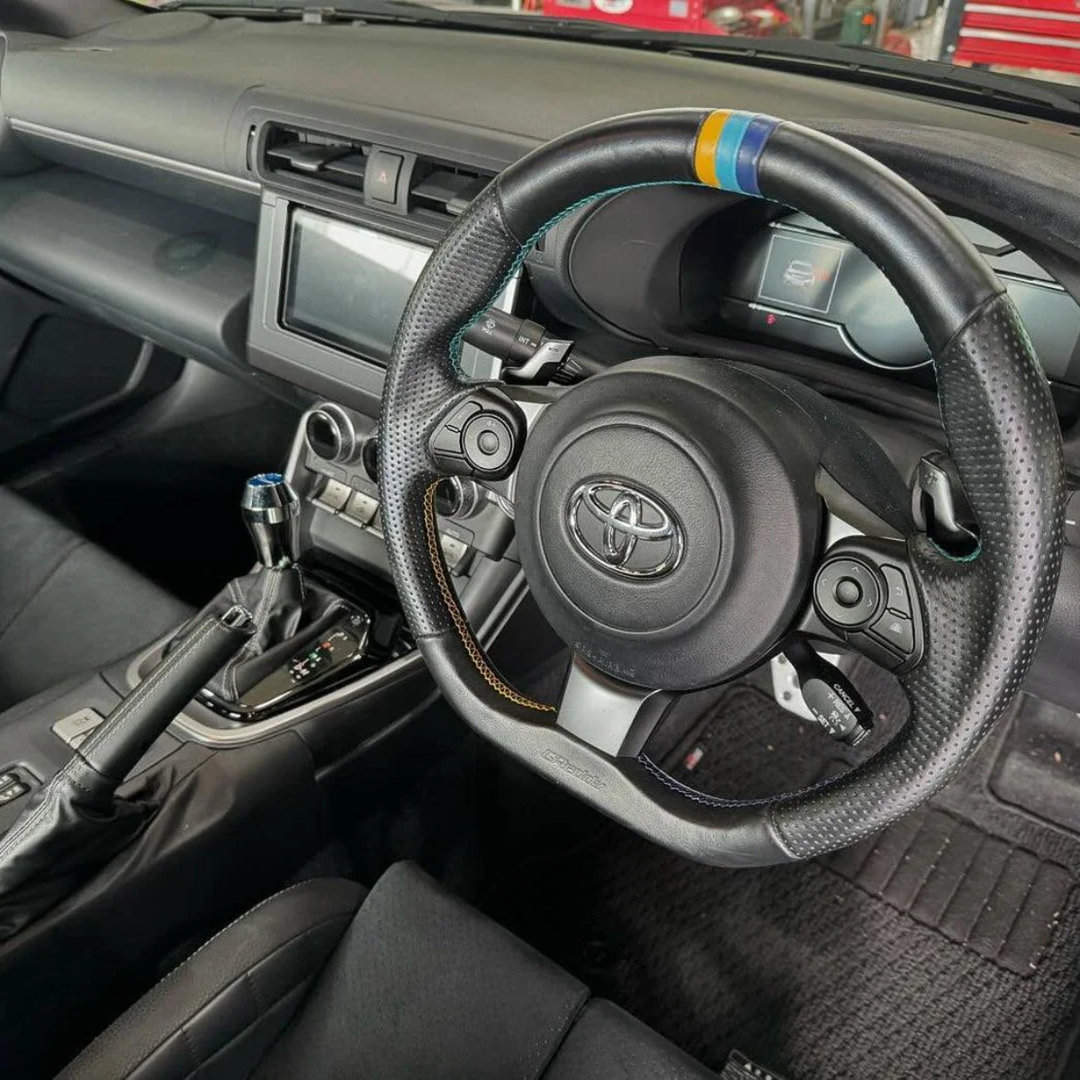 GReddy GR86 / BRZ All-Leather Steering Wheel w/ TRUST 3 Colored Stitching