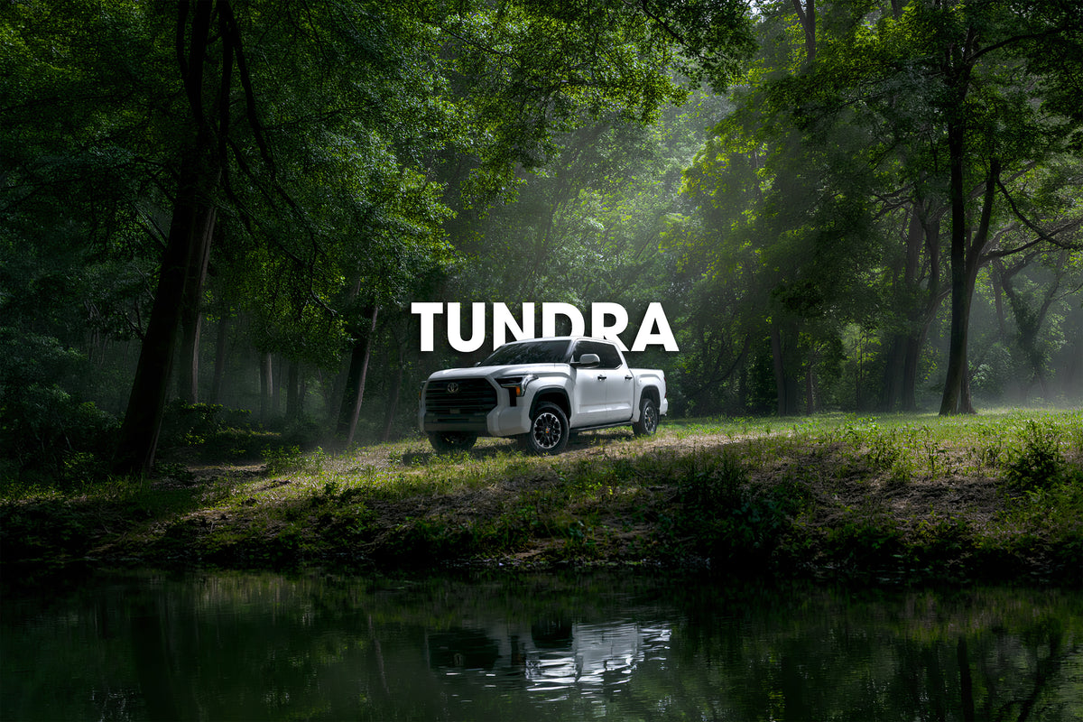 White Toyota Tundra in a misty forest clearing